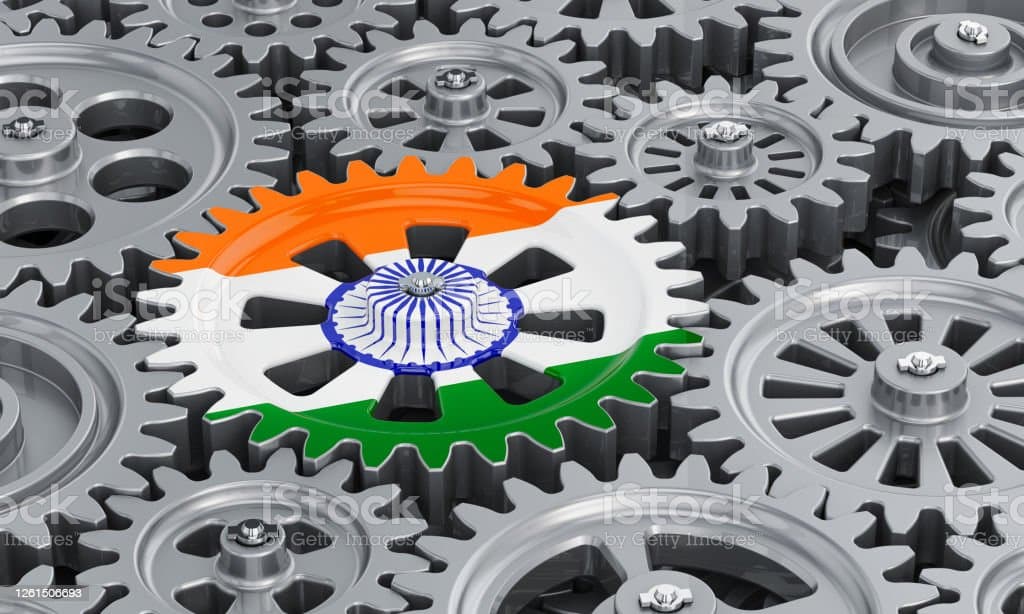 Indian flag on the gearwheel, business industrial concept. 3D rendering