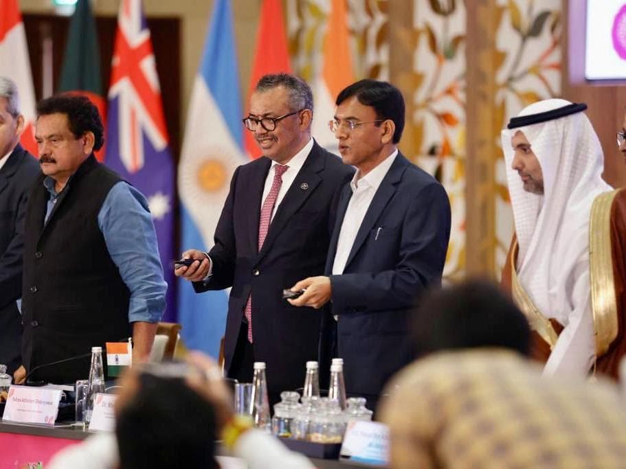 Tedros Adhanom Ghebreyesus(L) and Mansukh L. Mandaviya(R)