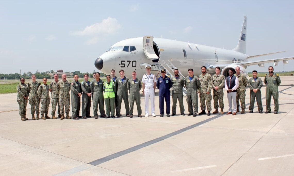 Sailors assigned to the “Tridents” of Patrol Squadron (VP) 26 and members of the Indian Navy Air Squadron (INAS) 312 “Albatross” pose for a photo upon the arrival of a US Navy P-8A Poseidon aircraft at Rajali, India