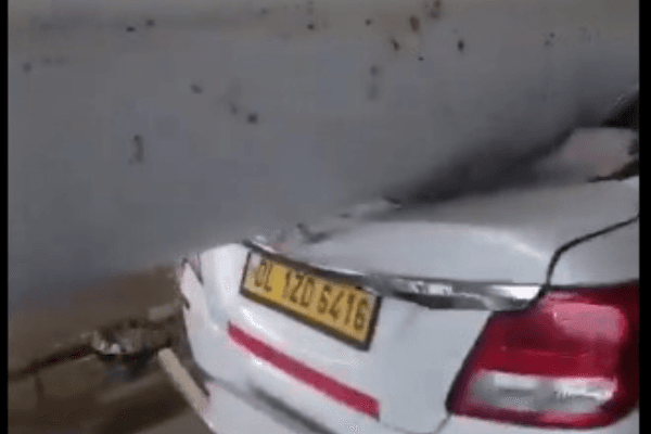 A portion of the roof landeed on a car parked at the terminal.