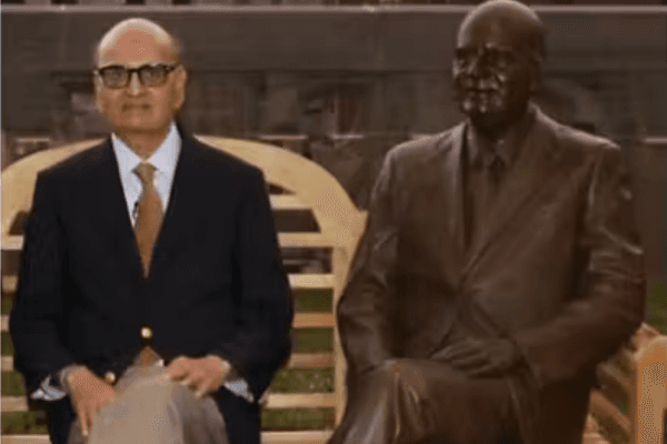 Jaydev R. Patel alongside his statue