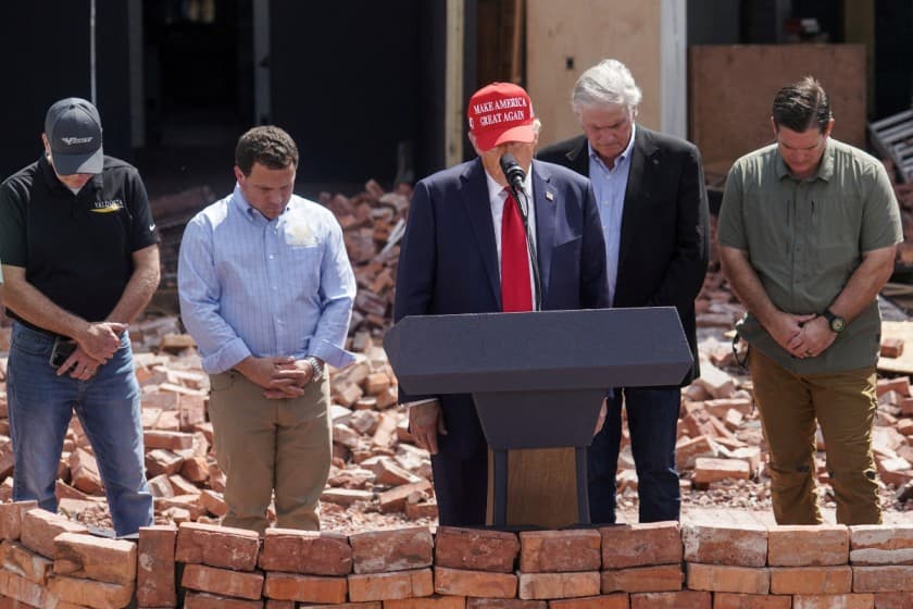 Republican presidential nominee and former U.S. President Donald Trump stands during a moment of silence at an event about the damage caused by Hurricane Helene, in Valdosta, Georgia, U.S., September 30, 2024. REUTERS/Elijah Nouvelage/File Photo