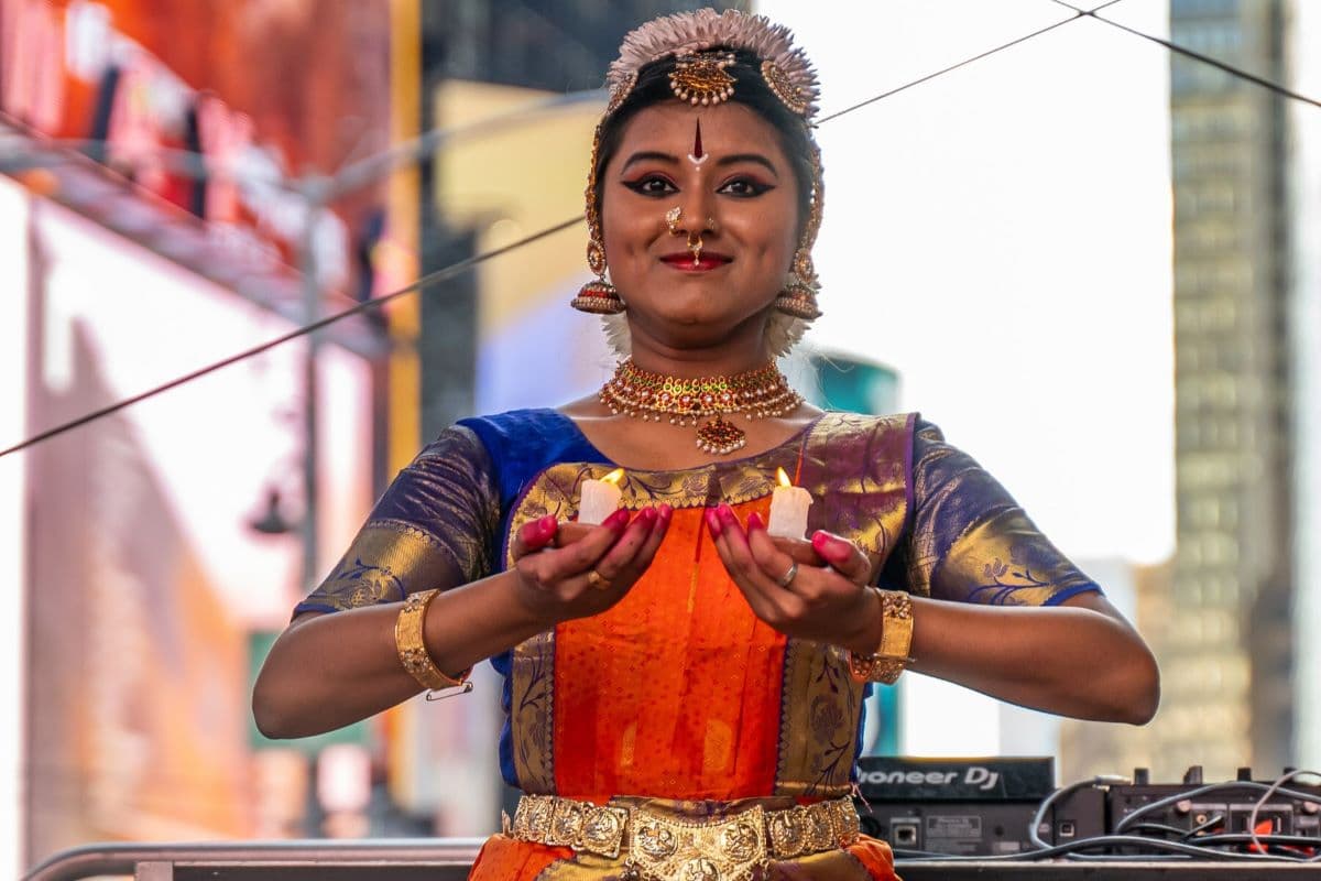 Classical Indian Dancer holding Diyas (lamps) at Times Square Diwali Celebrations.
