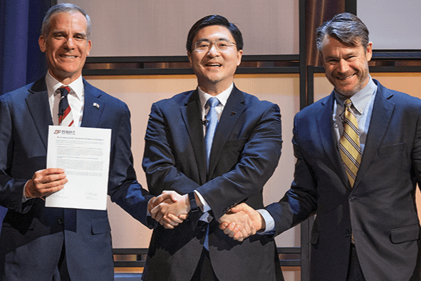 Purdue President Mung Chiang shakes hands Friday with (left) Eric Garcetti, U.S. ambassador to India, and U.S. Sen. Todd Young following the announcements of the first-ever Purdue-India Center for Education and Engagement and the U.S.-India Center of Excellence in Semiconductors, both in India. The afternoon announcement also included plans for dual and joint degree offerings and alumni engagement in India. 