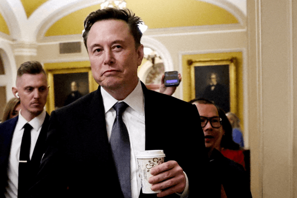 FILE PHOTO: Elon Musk walks on Capitol Hill on the day of a meeting with Senate Republican Leader-elect John Thune (R-SD), in Washington, U.S. December 5, 2024. 