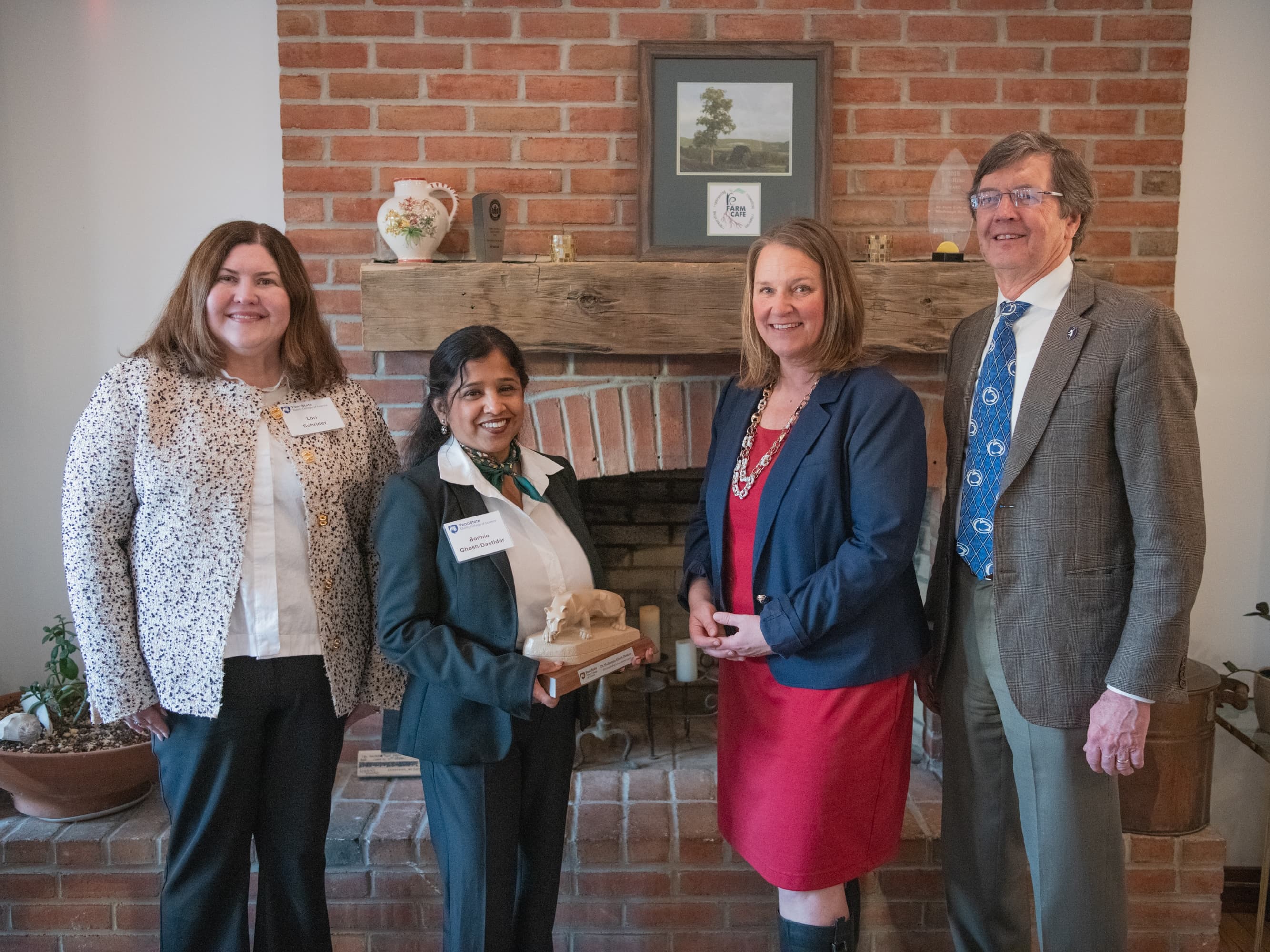 From left to right: Lori Schrider, Alumni Society Board president, Madhumita Ghosh-Dastidar, Outstanding Science Alumni Award recipient, Mary Beth Williams, acting dean for the Penn State Eberly College of Science, and Thomas Gardner, Outstanding Science Alumni Award recipient.  