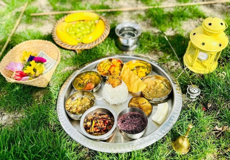 Fresh rice, vegetables, fruits, flower offering to household diety