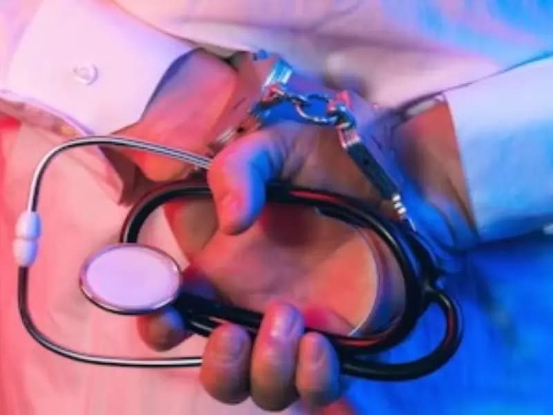 A doctor in handcuffs—Representative image