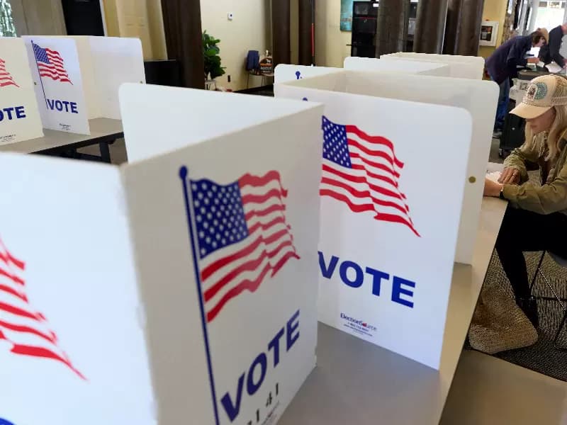 FILE PHOTO: A voter fills out a ballot at an El Dorado County polling station during California’s special election on Proposition 50, a measure that would temporarily redraw congressional districts, in El Dorado Hills, California, U.S., November 4, 2025. 
