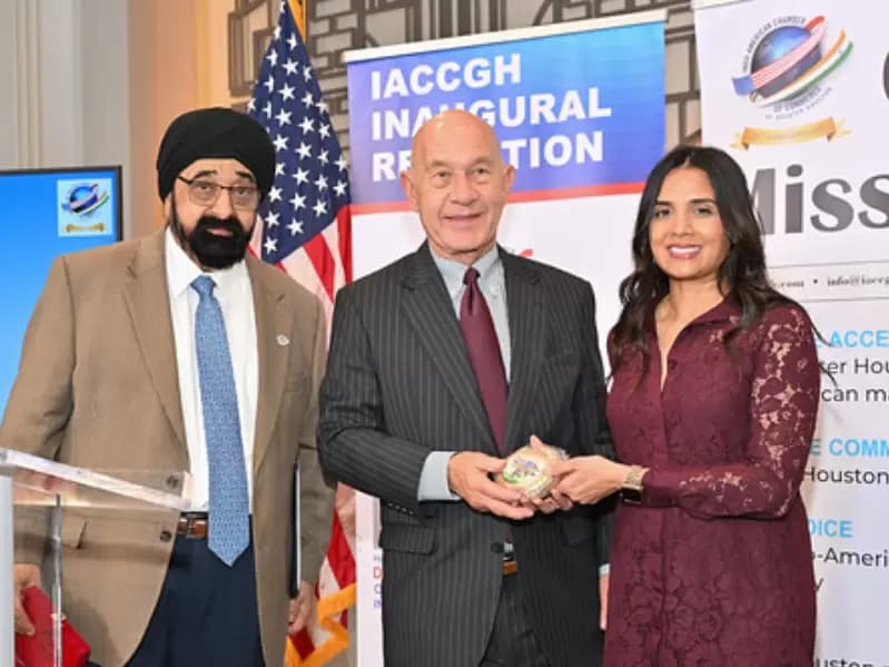 Mayor John Whitmire presented a token of appreciation by outgoing President Malisha Patel