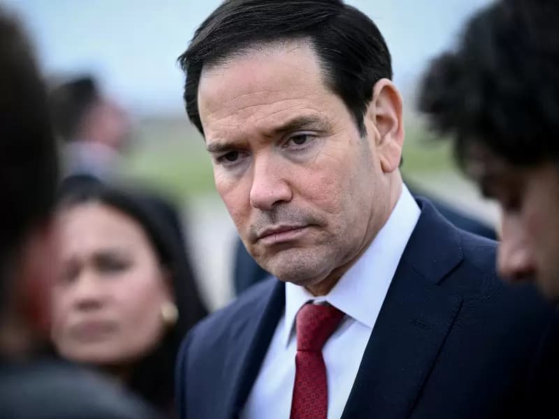U.S. Secretary of State Marco Rubio looks on as he speaks to the press before his departure following a G7 Foreign Ministers' meeting with Partner Countries before his departure at the Bourget airport in Le Bourget, outside Paris, France, March 27, 2026. 