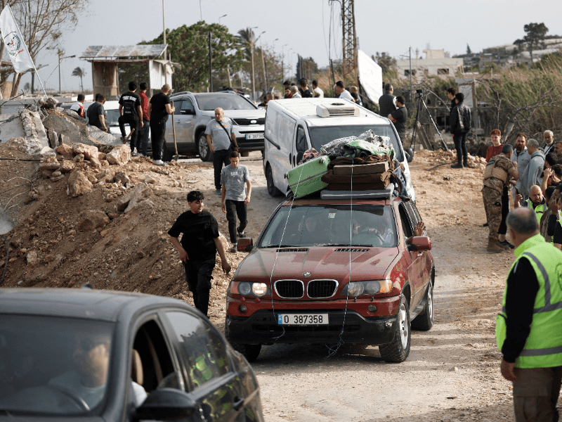 Displaced people make their way back to their homes as they cross the bridge linking southern Lebanon to the rest of the country, which was hit earlier in an Israeli strike, after a 10-day ceasefire between Lebanon and Israel went into effect, in Qasmiyeh, Lebanon, April 17, 2026. 