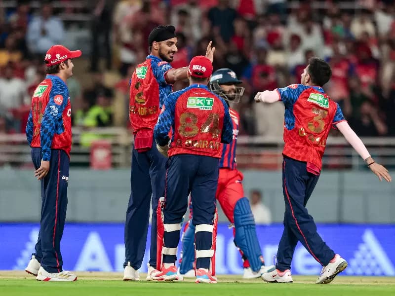 Punjab Kings' Arshdeep Singh celebrates with teammates after dismissing Lucknow Super Giants' captain Rishabh Pant 