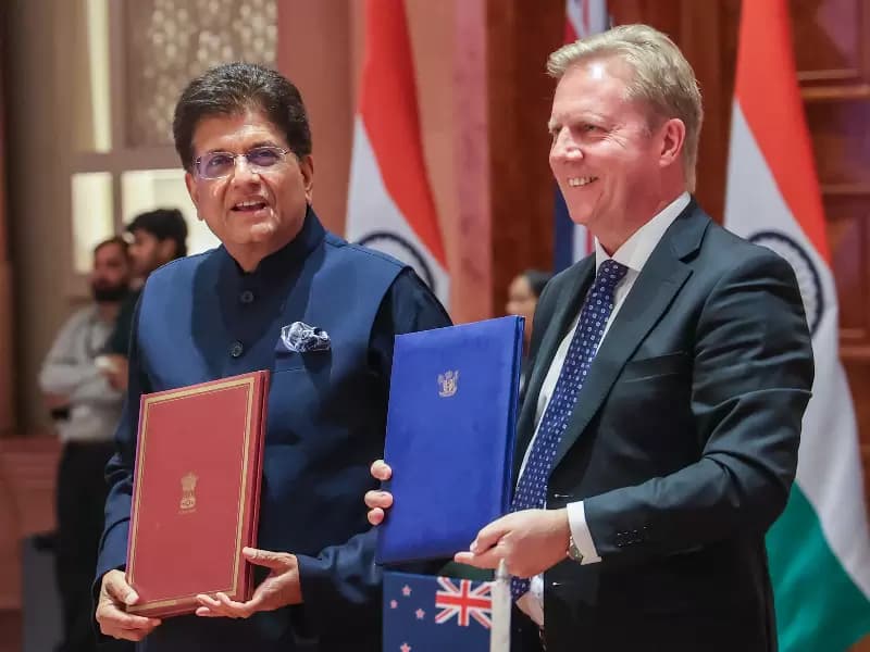 Union Minister Piyush Goyal and New Zealand’s Minister for Trade and Investment Todd McClay exchange an official document during the India-New Zealand Business Forum in New Delhi on Monday, April 27, 2026.
