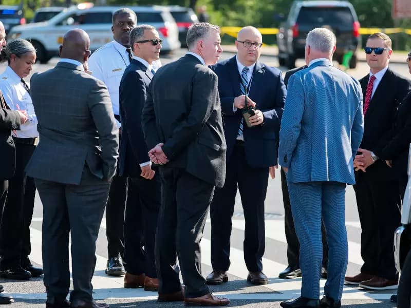 A U.S. Secret Service crime scene investigator works at the scene of an officer-involved shooting in Washington, D.C., U.S., May 4, 2026.