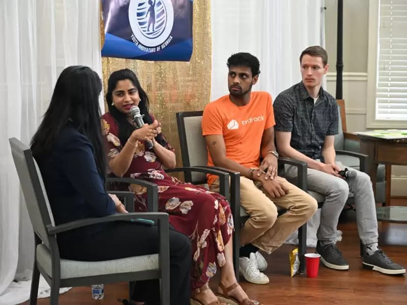 Aravind Ganesan and Deepti Talluri with other panelists