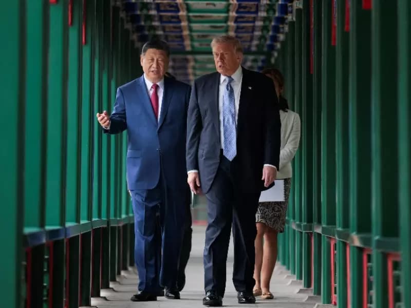 U.S. President Donald Trump participates in a friendship walk through Zhongnanhai Garden with Chinese President Xi Jinping in Beijing, China, May 15, 2026. 
