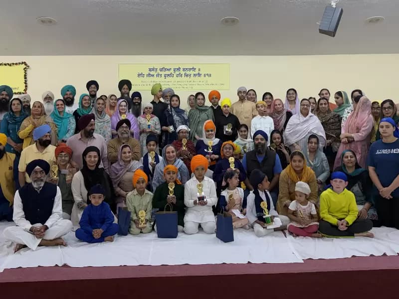 Symposium participants with family members and Volunteers