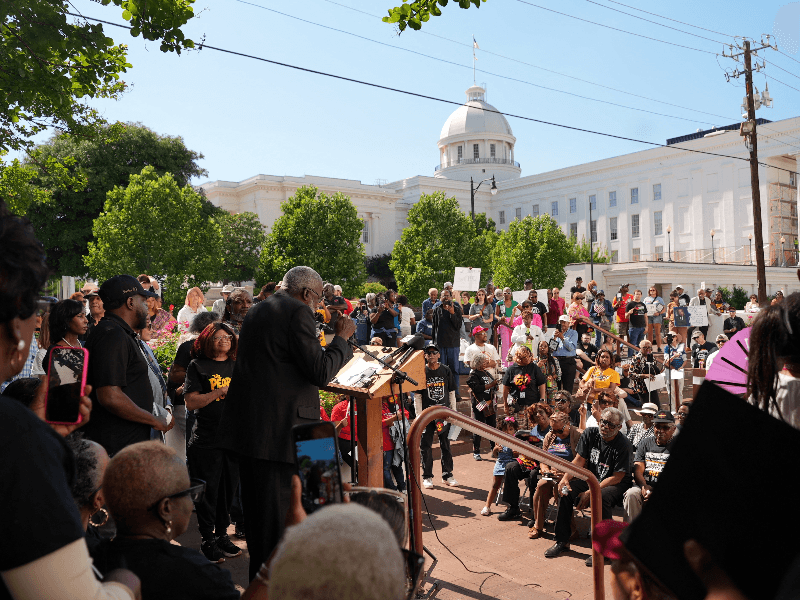 A speaker addresses protesters at a rally over voting rights and redistricting outside the state capitol in Montgomery, Alabama, U.S. May 4, 2026.