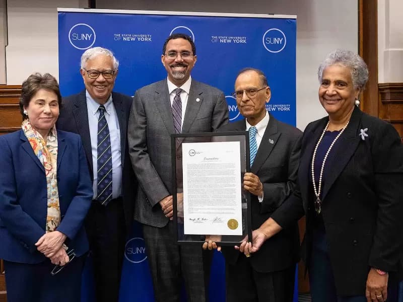 SUNY leaders honored UB President Satish K. Tripathi on June 2 for his 15 years leading the university.  From left: SUNY Board of Trustees Chair Meryl Tisch, Vice Chair Cesar Perales, SUNY Chancellor John B. King Jr., Tripathi, and SUNY Trustee Eunice Lewin. 