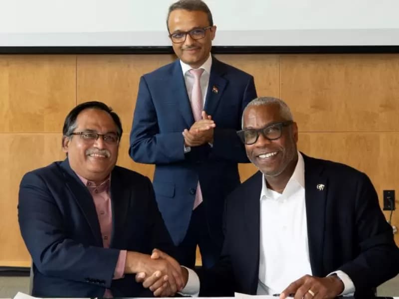 Shireesh Kedare and Timothy E. Sams in the presence of Consul General Binaya S. Pradhan