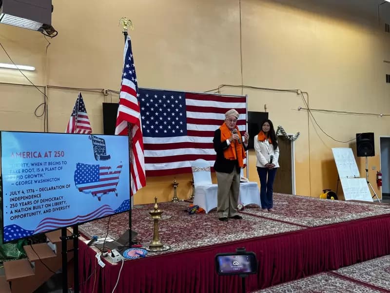 Irvine Mayor Larry Agran speaks during the America250 celebration at Irvine Hindu Mandir on July 11.