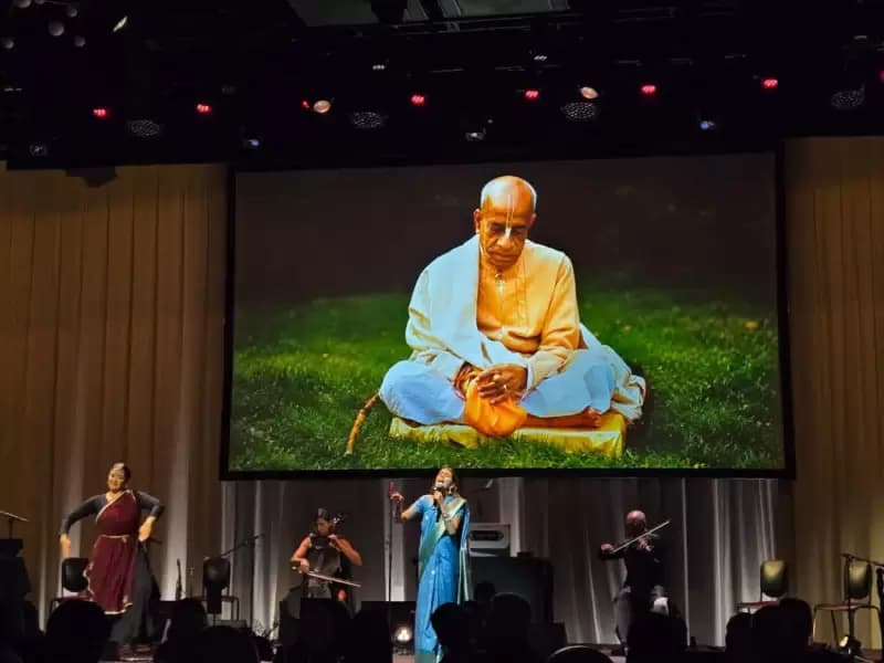 Mayuri Gandharvika, a third-generation devotee, sings at the sold-out event in NYC. 