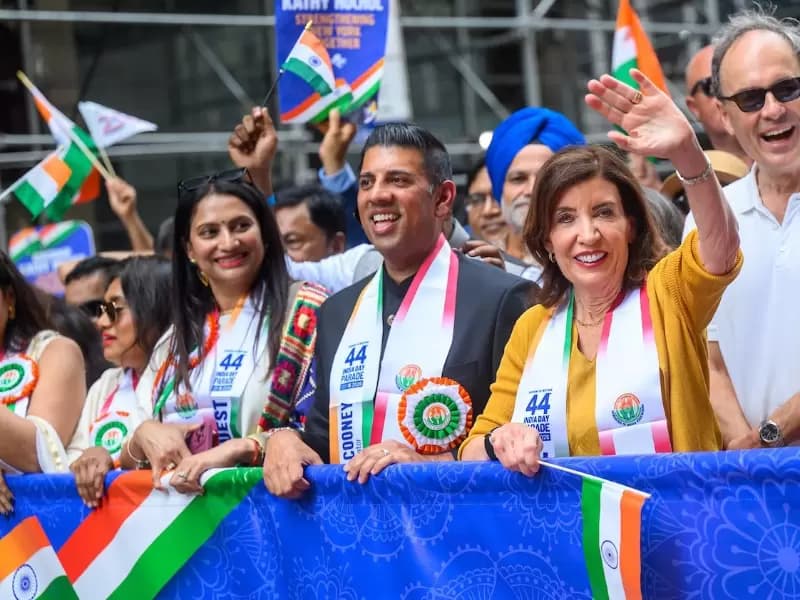 New York Governor Kathy Hochul, right foreground, marches at the India Day Parade in New York City on Aug 17