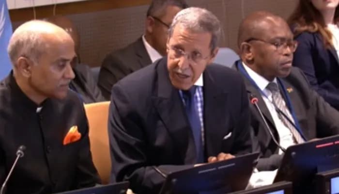 Morocco's Permanent Representative Omar Hilale speaks at a commemoration of the Intrnational Day of Non-Violence at the United Nations on Friday, October 2, 2026. He is flanked by Permanent Representatives P Harish of India, left, and Mxolisi Sizo Nkosi of South Africa. 