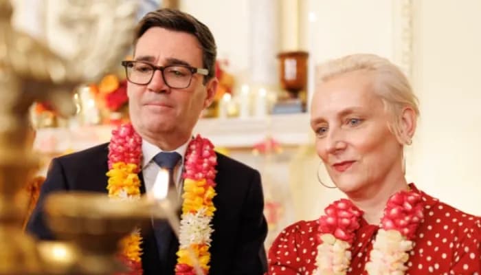 PM Andy Burnham lighting up the ceremonial lamp with this wife