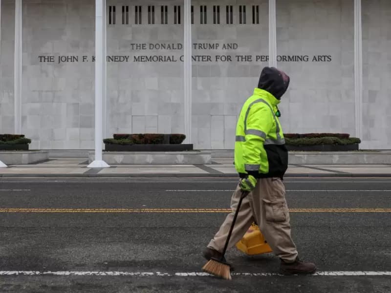 A worker walks in front of the recently renamed Donald J. Trump and John F. Kennedy Memorial Center for the Performing Arts, in Washington, D.C., U.S., December 29, 2025. 