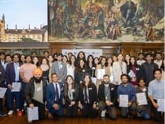 Group of scholarship recipients with their certificate