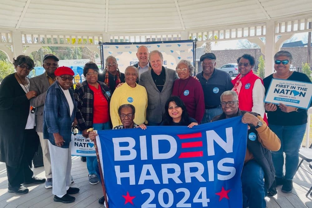 Harini Krishnan (center), national director of South Asians for Biden, is shown with a group of volunteers for the Biden-Harris re-election campaign