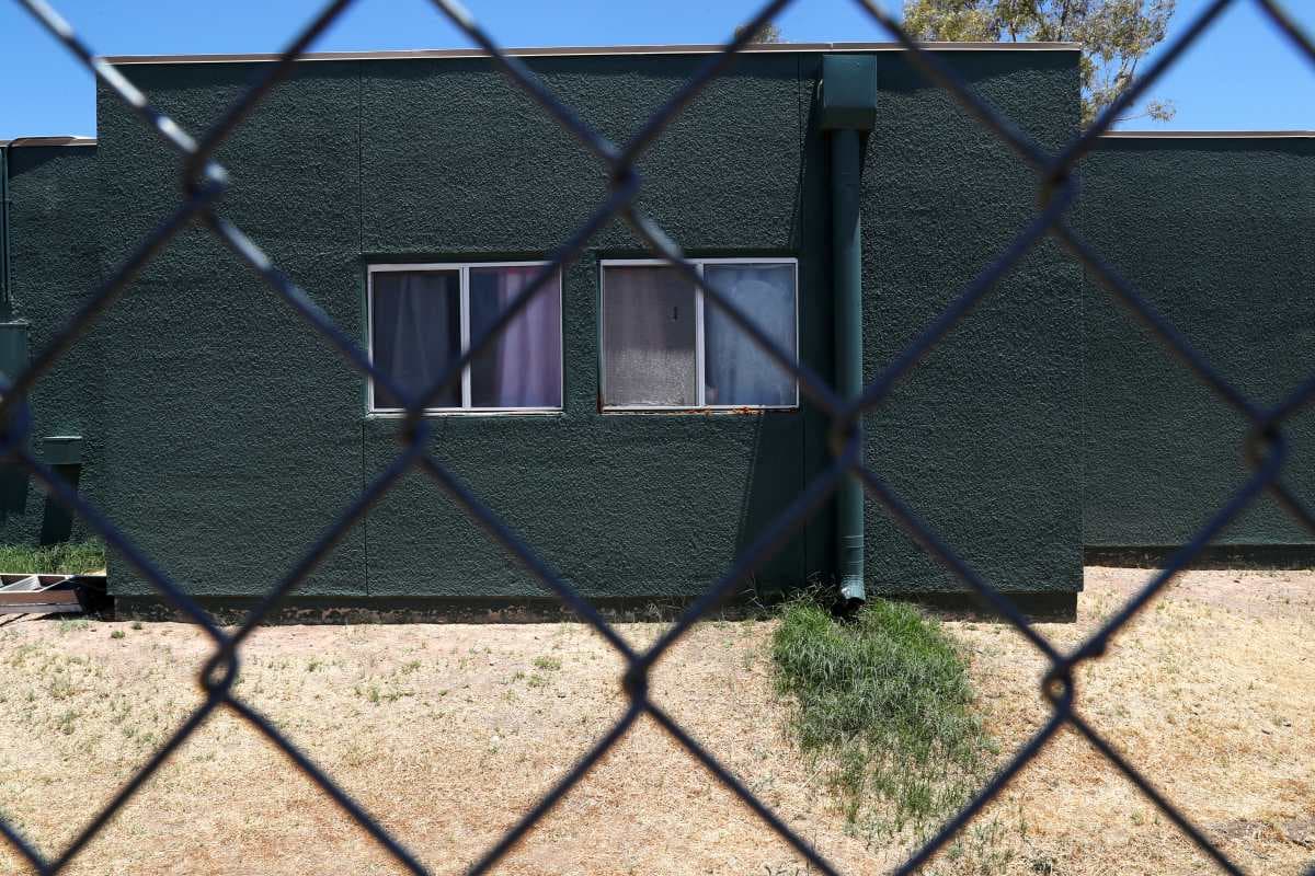 Windows are seen behind chain link fencing at an immigration detention facility for children run by Southwest Key Programs and the U.S. Department of Health and Human Services as U.S. first lady Melania Trump tours the facility in Phoenix, Arizona, U.S., June.28, 2018.