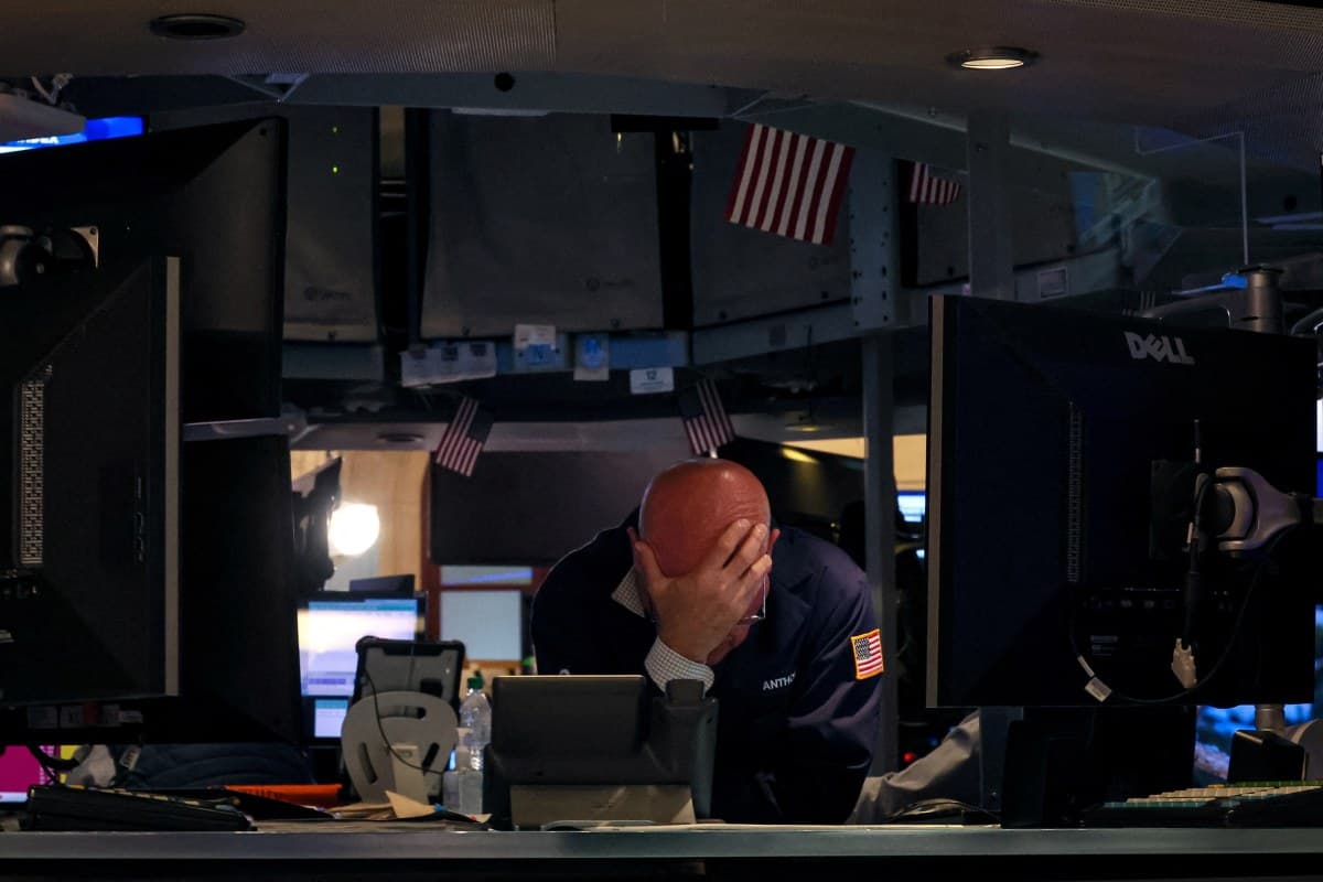 A specialist traders works at his post on the floor at the New York Stock Exchange (NYSE) in New York City, U.S., June.12, 2024.