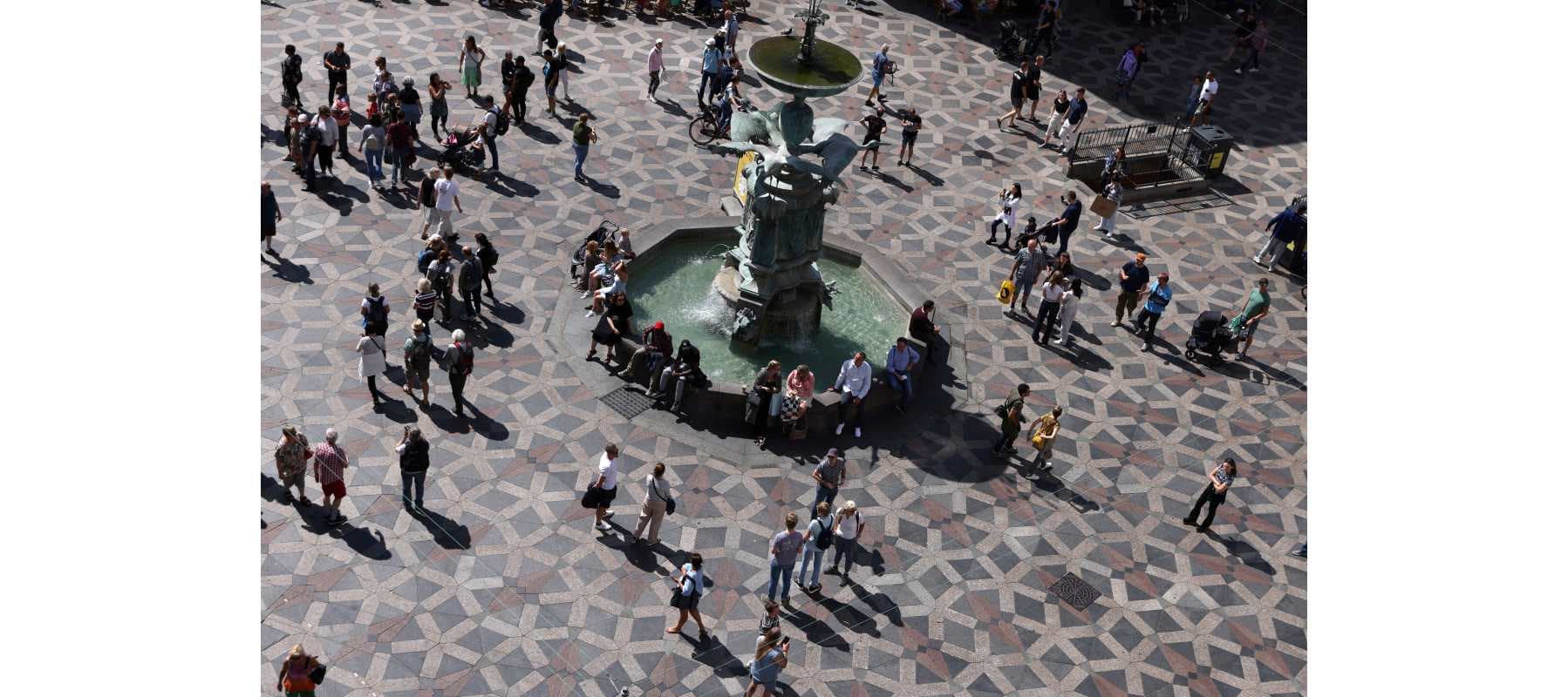 People walk at Amagertorv square in Copenhagen, Denmark, July 30, 2022.
