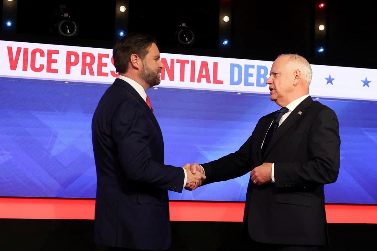 Democratic vice presidential nominee Minnesota Governor Tim Walz and Republican vice presidential nominee U.S. Senator JD Vance (R-OH) shake hands as they attend a debate hosted by CBS in New York, U.S., Oct.1, 2024.