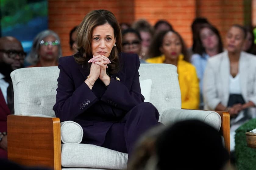 Democratic presidential nominee and U.S. Vice President Kamala Harris listens to a victim of a school shooting, at a campaign event in Detroit, Michigan, U.S., September 19, 2024. REUTERS/Kevin Lamarque