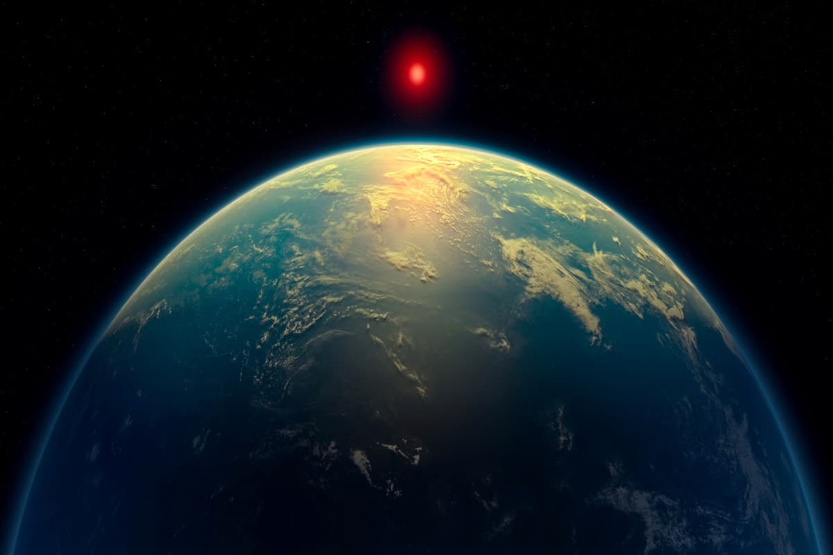 An illustration shows a hycean world – an exoplanet with a liquid water ocean beneath a hydrogen-rich atmosphere - orbiting a red dwarf star. Based on observations by the James Webb Space Telescope, the exoplanet K2-18 b might fit in this category. This illustration was obtained by Reuters on April 16, 2025.