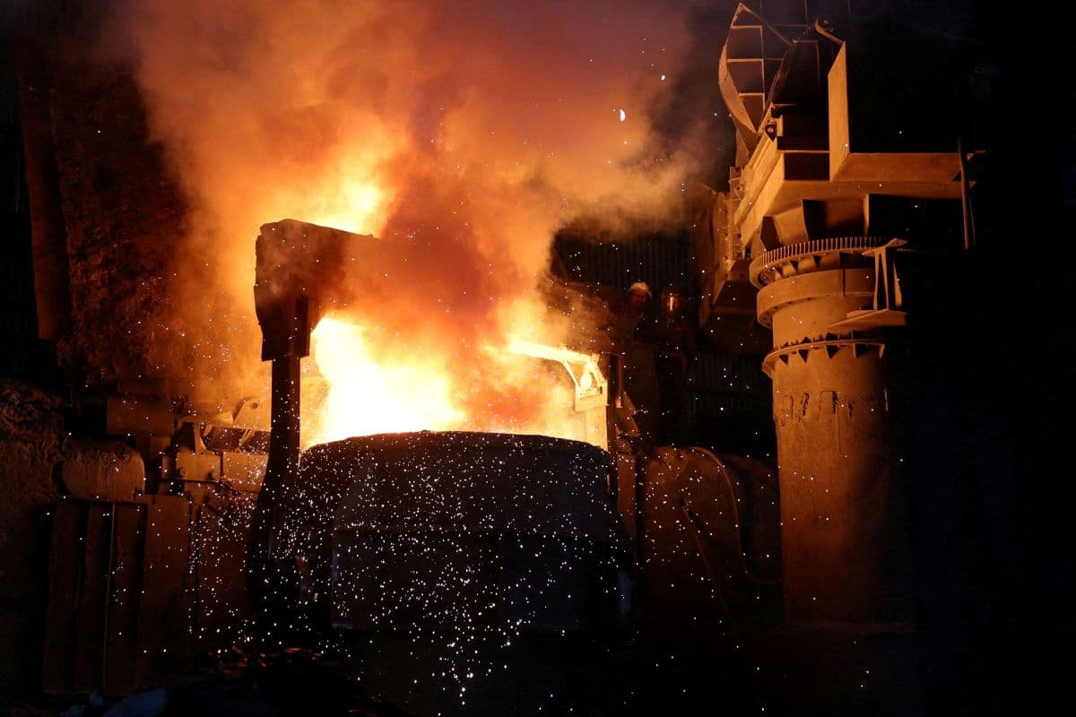 Employee fill melted steel into a container inside a steel bar manufacturing factory at Viramgam, in the western Indian state Gujarat, India, April 7, 2025.