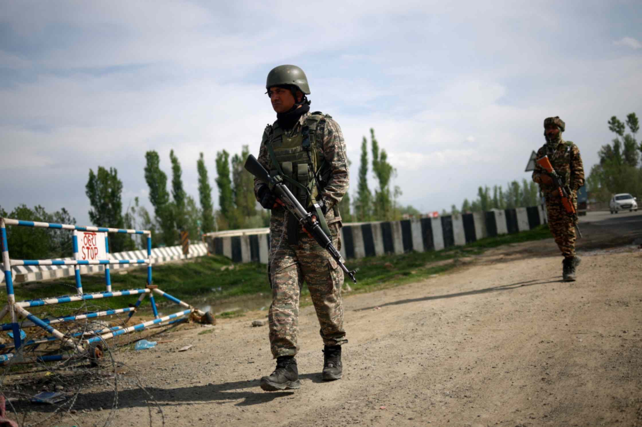 Members of Indian security personnel patrol on a highway leading to South Kashmir's Pahalgam, following a suspected militant attack, in Marhama village, in Kashmir, Apr. 23, 2025.