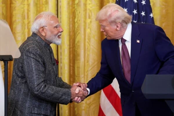 FILE PHOTO: U.S. President Donald Trump and Indian Prime Minister Narendra Modi shake hands as they attend a joint press conference at the White House in Washington, D.C., U.S., February 13, 2025.