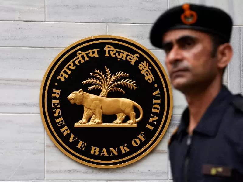 A man walks past the Reserve Bank of India (RBI) logo outside its headquarters in Mumbai, India, June 6, 2025.