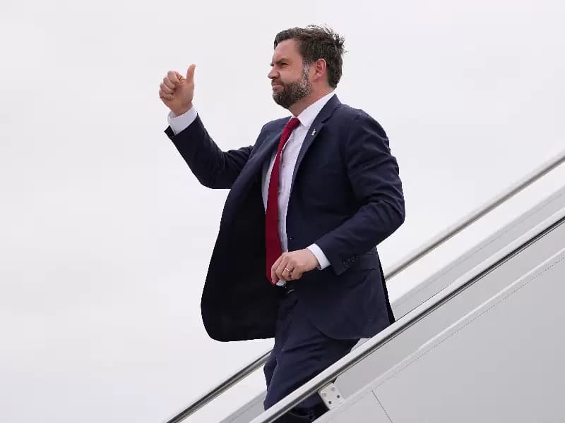 U.S. Vice President JD Vance gestures as he steps off Air Force Two at Central Wisconsin Airport in Mosinee, Wisconsin, U.S., February 26, 2026.