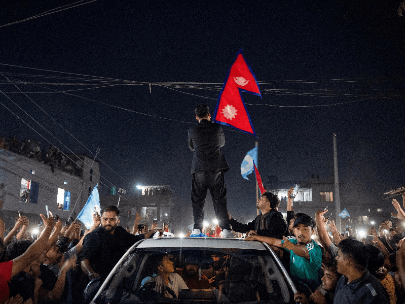 Balendra Shah, a rapper-turned-politician waves national flag after winning the election, in Damak, Jhapa district, Nepal, March 7, 2026.