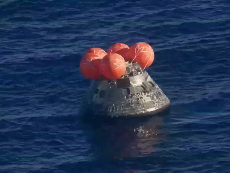 The Artemis II crew capsule floats in the Pacific Ocean following splashdown in this screengrab from a livestream video after the Artemis II crew's flyby of the Moon, April 10, 2026.