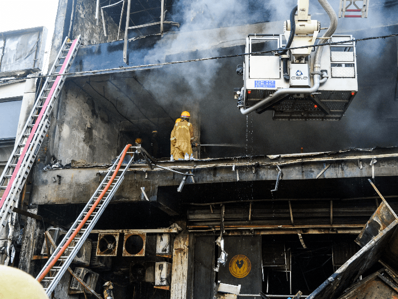 Lucknow: Firefighters conduct rescue and relief operations after a fire broke out in a multi-story building housing a coaching center in the Aliganj area of Lucknow on Monday, June 22, 2026.